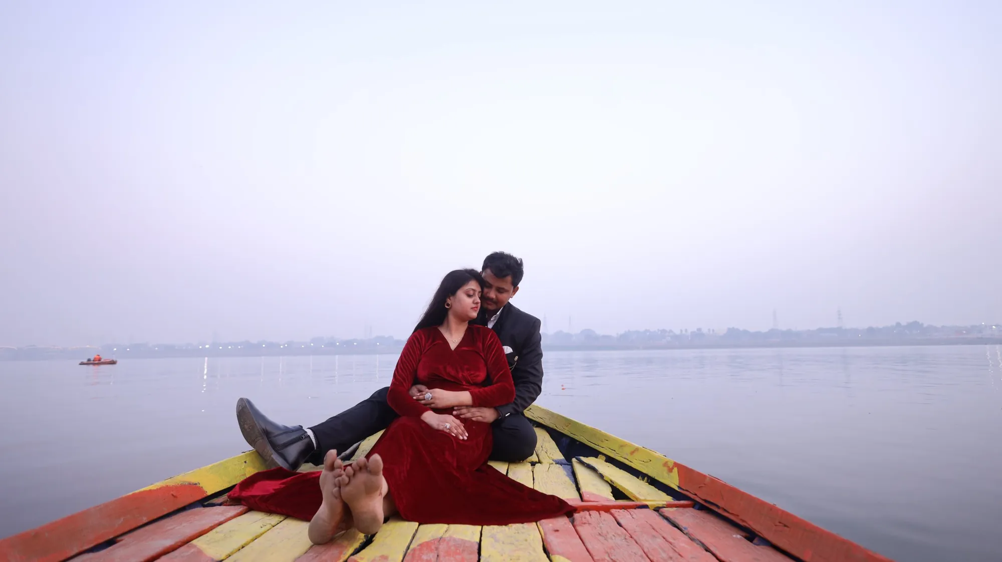 Pre-wedding couple on a boat on the river